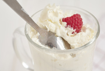 Whipped cream with fresh berry. Close up