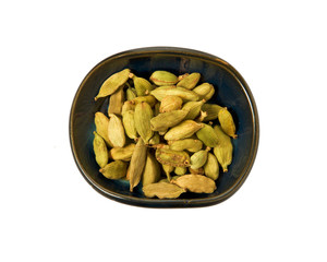 Dry fennel seeds in a bowl isolated on a white background. Seasoning on isolate. View from above. Close up view of fennel.