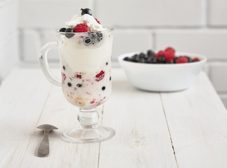 Glass with ice cream and fresh berry