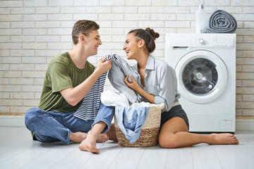 loving couple is doing laundry