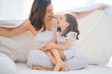 girl and her mother enjoy sunny morning