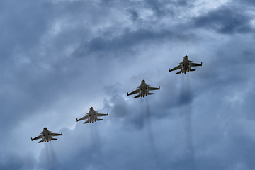 Fototapeta na wymiar Four airplanes in a diagonal row flying upwards