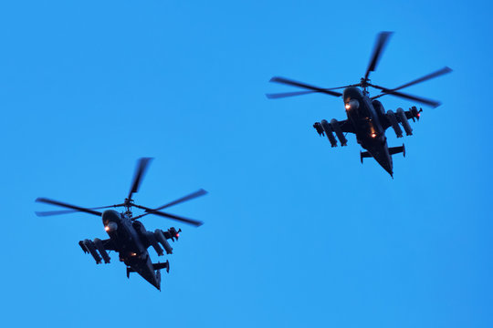 Two helicopters in a diagonal row