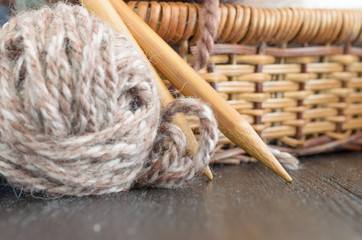 Crochet and knitting set. Yarn balls and wood needles. Homemade hobby concept.