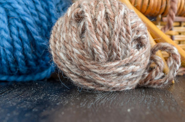 Crochet and knitting set. Yarn balls and wood needles. Homemade hobby concept.