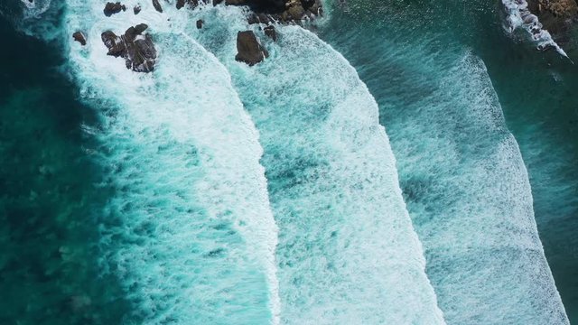 Waves breaking over a reef from above