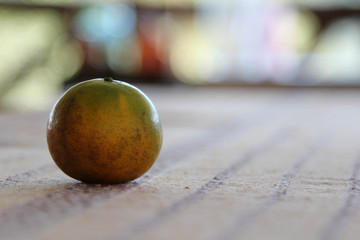 Fresh ripe tangerine on wooden table.