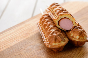 Corndogs on a wooden table
