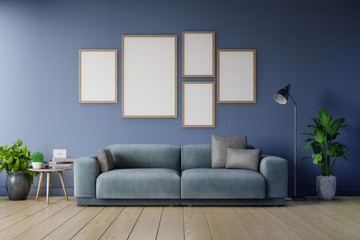 Poster mockup with vertical frames on empty dark wall in living room interior ad dark blue sofa.