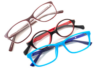 Three pairs of colorful children's glasses.  Isolated
