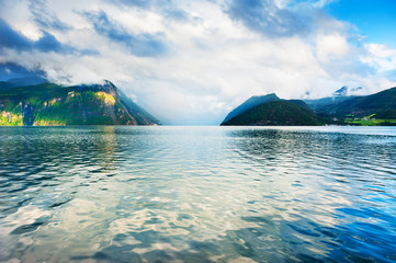 Mountains with clouds on the fjord in Norway. Beautiful norwegian landscapes