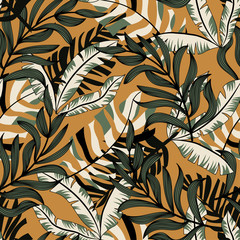 Trending abstract seamless pattern with colorful tropical leaves and plants on orange background. Vector design. Jungle print. Floral background. Printing and textiles. Exotic tropics. Summer.