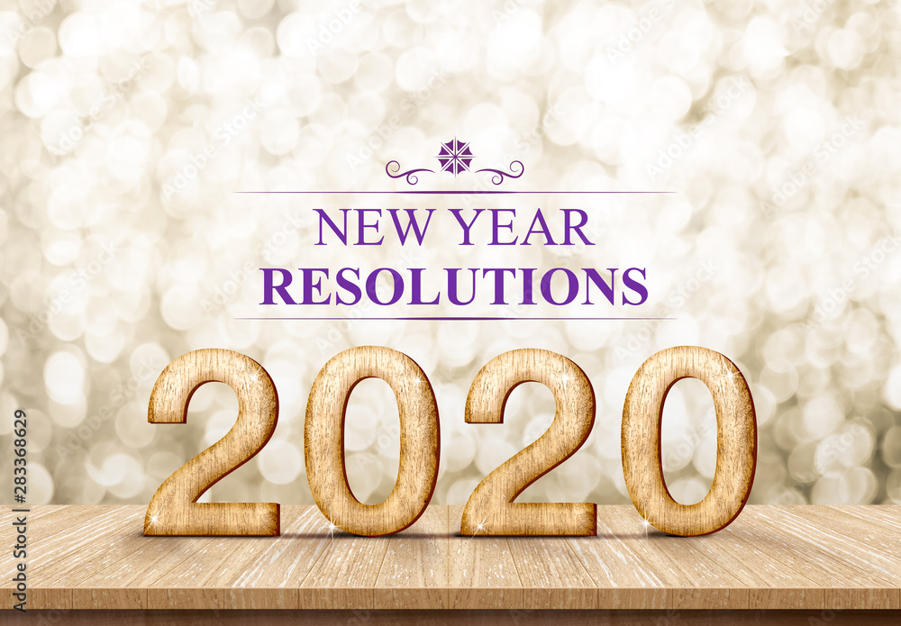 Poster 2020 happy new year rosolutions (3d rendering) on wood table with sparkling gold bokeh wall,leave space for display or montage of design or content.