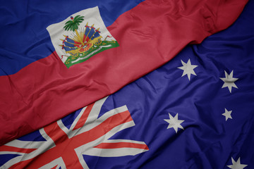waving colorful flag of australia and national flag of haiti.