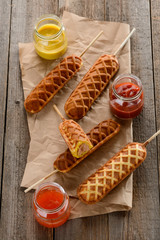 Corn dogs with different condiments