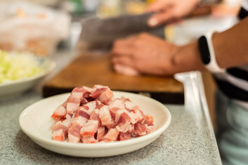 cut raw pork on wooden table