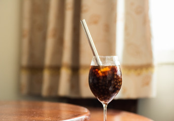 pearl milk tea on glass with stainless steel straw