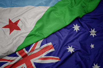 waving colorful flag of australia and national flag of djibouti.
