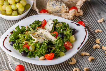 salad provence with blue cheese on wooden table