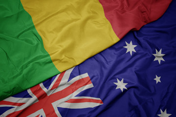 waving colorful flag of australia and national flag of mali.
