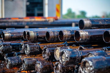 Oil Drill pipe. Rusty drill pipes were drilled in the well section. Downhole drilling rig. Laying...