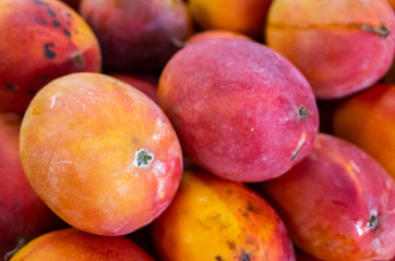 red stacks of mango fruits