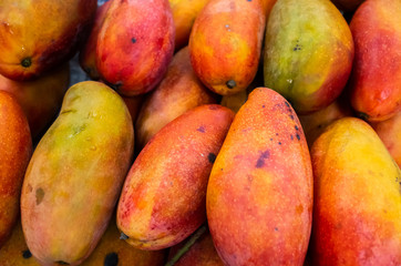 red stacks of mango fruits