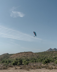 Fototapeta na wymiar Paragliding in the mountains
