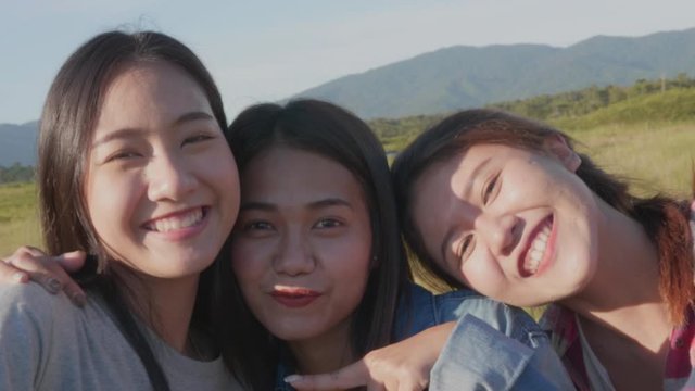 Group of young Asian women doing salfi on the phone, smiling, having fun and happy on summer holiday vacation.