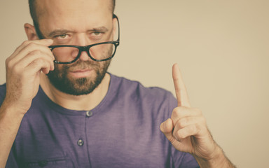 Adult man being angry pointing with finger