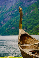 Old viking boat on fjord shore, Norway