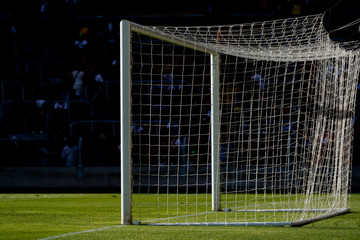 Soccer and football goal cage with black background