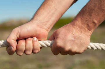 the man pulls the rope
