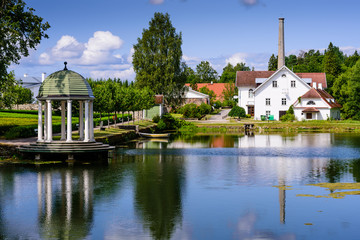 Sightseeing of Estonia. Palmse manor (Palmse möis) museum in Lahemaa National Park. Beautiful summer landscape. A picturesque Park with a pond.