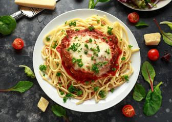 Chicken Parmesan with Cheese and Marinara Sauce served over spaghetti, pasta