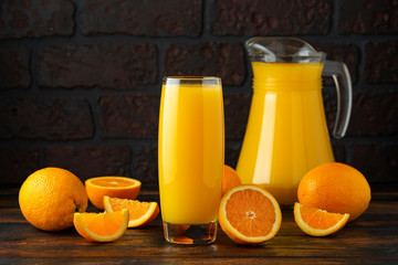 Orange juice in glass on rustic wooden table