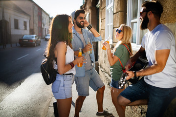 Group of young people smiling, talking and having fun together