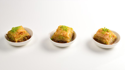 Pistachio baklava on a white background. Dessert.