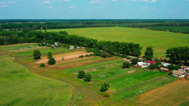 4K Drone. Aerial view of Desna, an urban-type settlement in Kozelets Raion, Chernihiv Oblast in northern Ukraine. Shot on a bright summer day with blue sky and few clouds.
