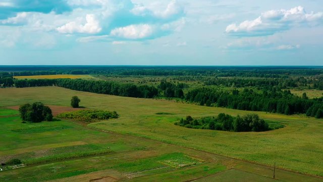 4K Drone. Aerial view of Desna, an urban-type settlement in Kozelets Raion, Chernihiv Oblast in northern Ukraine. Shot on a bright summer day with blue sky and few clouds.