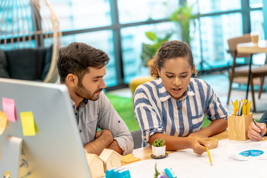 Team of young Business starter is brainstroming in a co working space