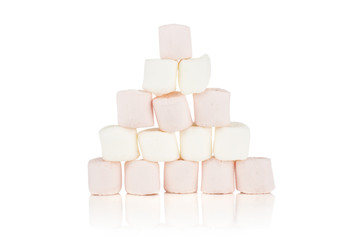 Lot of whole sweet fluffy marshmallow pyramid isolated on white background