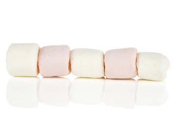 Group of five whole pink and white sweet fluffy marshmallow in row isolated on white background