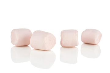 Fototapeta na wymiar Group of four whole sweet fluffy marshmallow isolated on white background