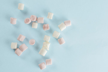 Lot of whole sweet fluffy marshmallow flatlay isolated on sky blue background