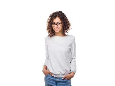 Portrait of a smiling Indian young woman in a jumper on a white isolated background in studio. Happy young muslim woman in sweater. 