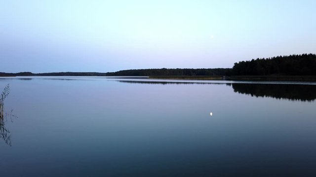 Summer night in Archipelago Sea (Saaristomeri in Finnish), Finland. Totally calm water surface.