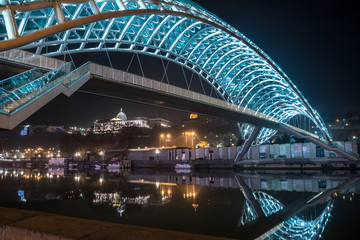 Pedestrian bridge of peace over the Mtkvari (Kura) River in Tbilisi at night. © k_samurkas