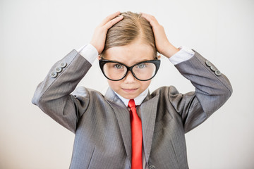 Cute boss girl holding her head. The business problem concept