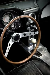 Foto auf Acrylglas Beautiful Vintage American Sport Car Dark Interior © rstpierr